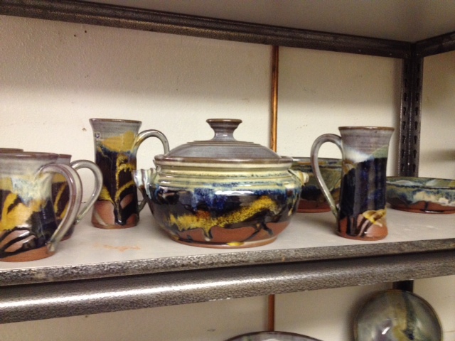 A shelf of Prairies glazed pots. 