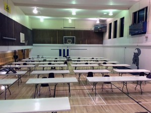 The gym with tables waiting for the show.